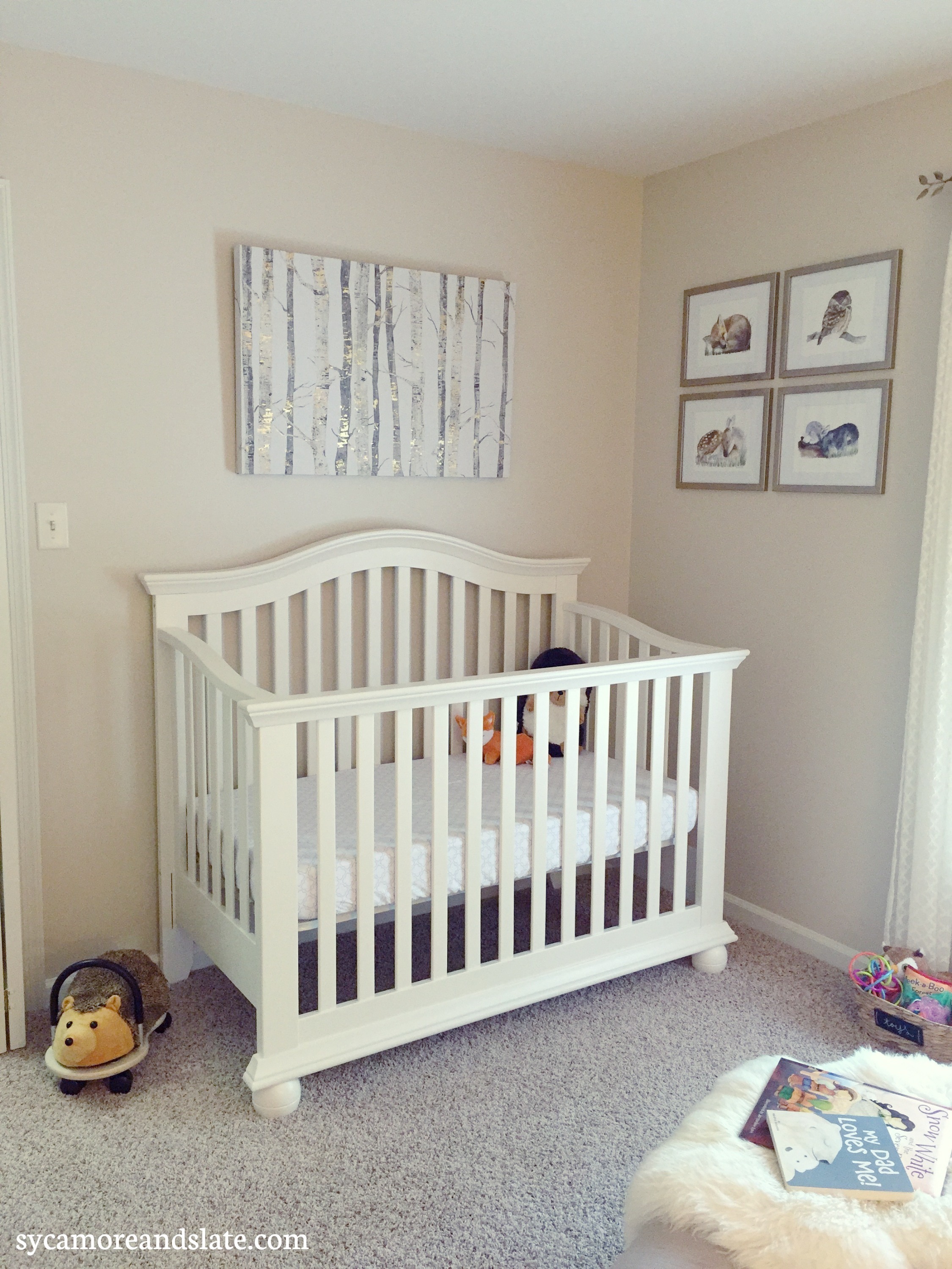 crib with wall art