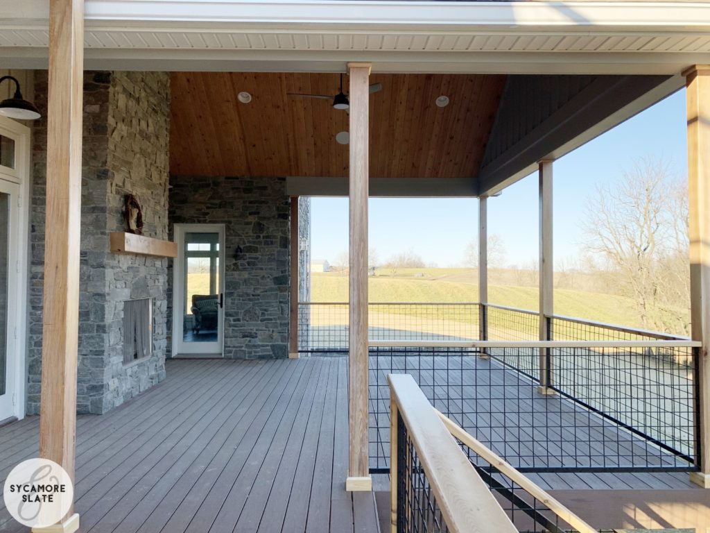 outdoor living room on deck with fireplace