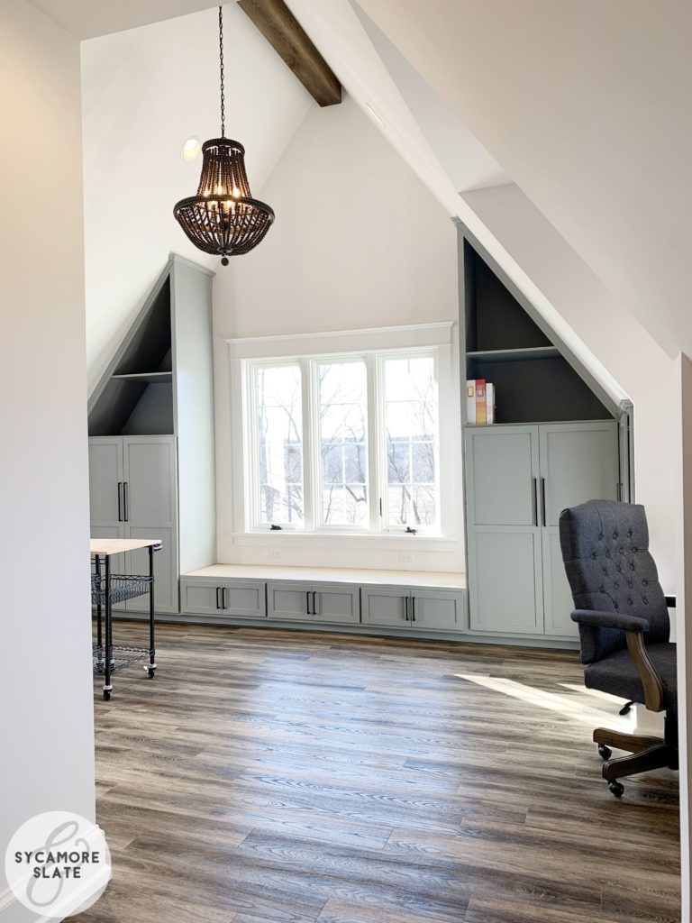 window seat in the laundry room with storage